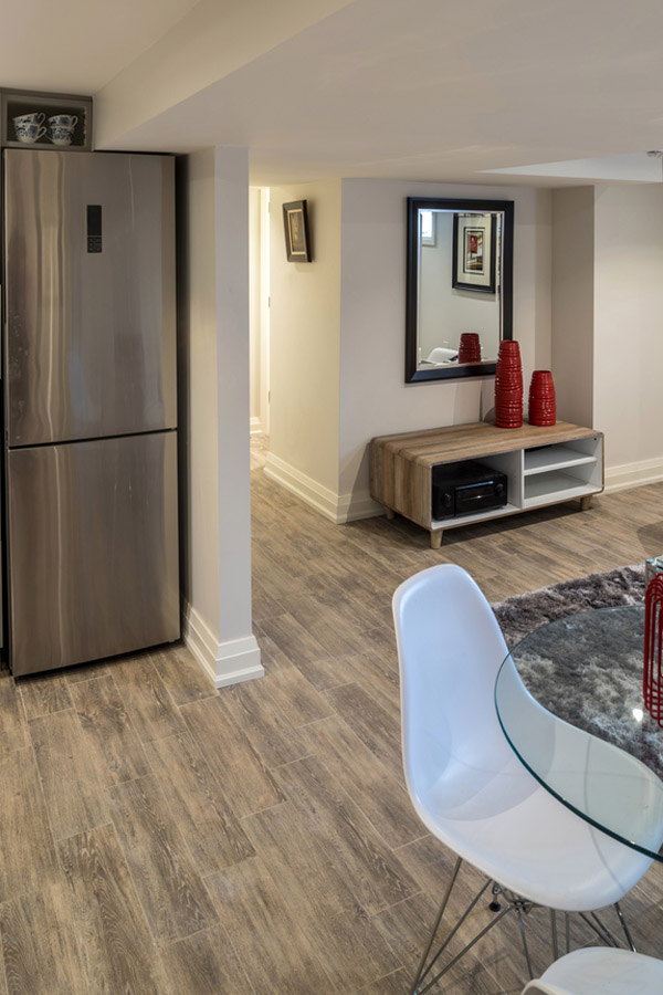 Finished basement with a kitchenette and dining area
