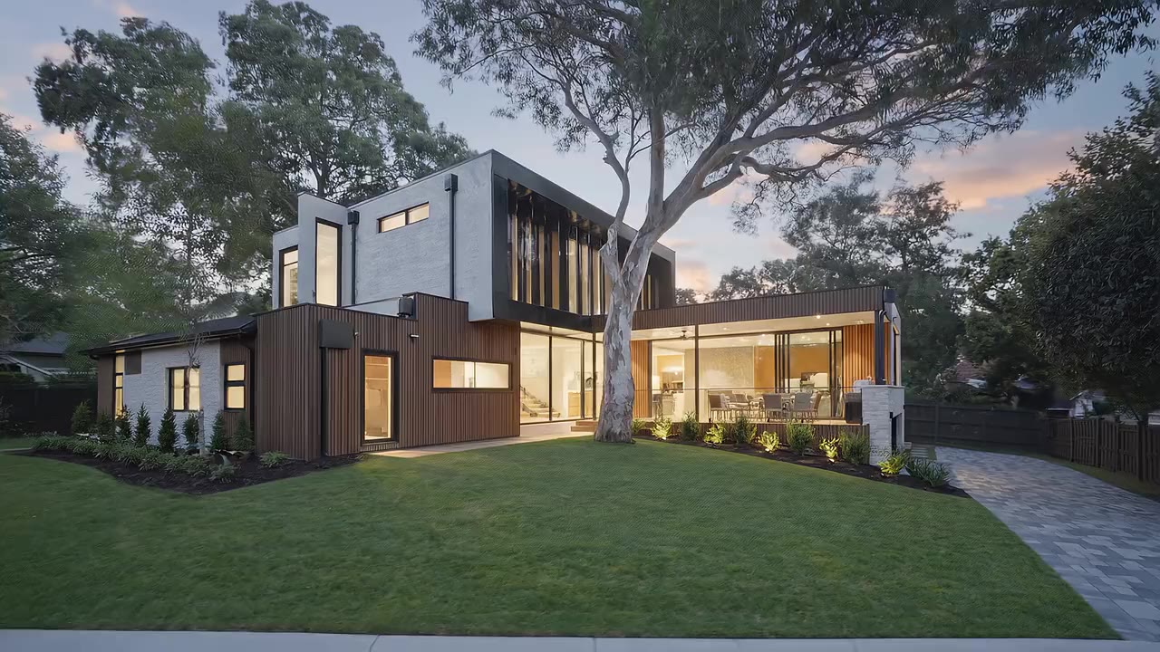 Custom home on Long Island at dusk, built by Keystone Construction